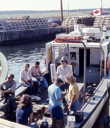 <B>Early Field Trip in PEI to Track Tuna</B><BR>Recognizable individuals: Mike Butler (white shirt and hat), Doug Pincock (light blue shirt and funny hat), Claude Bercy, University of Paris (on gunwale)